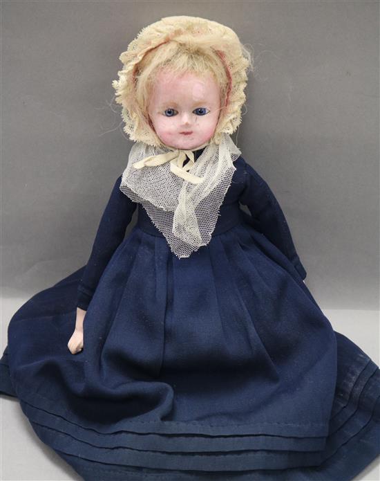 A 19th century wax-head doll with 'talking' mechanism